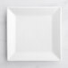 An Acopa bright white square porcelain plate on a white surface.
