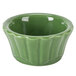 A green china floral ramekin with a scalloped edge.