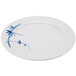 A white plate with blue bamboo design on it.