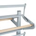 A white metal Bulman horizontal paper rack with a wooden handle.