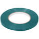 A roll of teal Shurtape with a white circle in the middle.