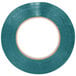 A roll of Shurtape green poly bag sealer tape with a circle in the middle.