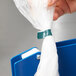 A hand using Shurtape to seal a plastic bag