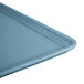 A teal Cambro dietary tray with a close-up of the blue surface.