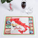 A Hoffmaster Historic Italia paper placemat on a table with glasses of wine and a map of Italy.