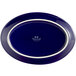 A cobalt blue oval china platter with a white border.
