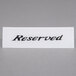 An American Metalcraft white rectangular plastic table tent with the word "Reserved" in black.