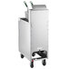 A Frymaster stainless steel liquid propane floor fryer on a silver cart with a basket.