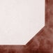 The corner of a white wall with a burgundy menu paper with a marble border.