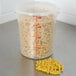 A Cambro translucent round polypropylene food storage container filled with pasta.