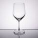 A Stolzle clear wine glass on a reflective surface.