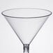 A clear plastic martini glass with a stem.