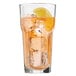 A Libbey Gibraltar cooler glass of ice tea with a lemon slice.