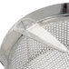 A close-up of a Tellier tin-plated steel sieve with a metal handle.