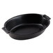 A close-up of a Dart black laminated oval foam casserole dish with handles.