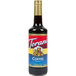 A Torani Coffee Flavoring Syrup 750 mL glass bottle with a red label.