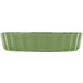 A green rectangular dish with scalloped edges.