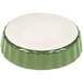 A green and white ceramic CAC quiche dish with fluted edges.