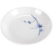 A white Thunder Group sauce dish with blue bamboo design.