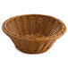 A honey-colored round polyweave basket with a handle.