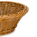 A round honey-colored polyweave basket with a handle.