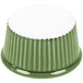 A green fluted ramekin with a white background.
