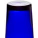 A blue Libbey customizable cooler glass on a table.