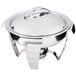 A Vollrath stainless steel round chafer with stainless steel accents and a lid.