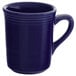 A dark blue Tuxton Concentrix coffee mug with a handle.