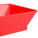 A red square plastic basket with a chile design.