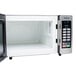 A Panasonic stainless steel commercial microwave with the door open.
