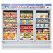A white Turbo Air glass door merchandising freezer full of frozen food on shelves.