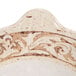 A white melamine bowl with brown and white designs.