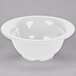 A white GET Diamond Mardi Gras melamine bowl on a gray surface.
