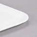 A white rectangular Cambro dietary tray with a handle.