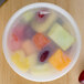 A bowl of fruit in a Pactiv translucent plastic deli container.