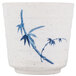 A white and blue melamine cup with bamboo design.