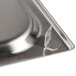 A close-up of a Vollrath stainless steel steam table adapter plate with two holes.