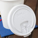 A Solo white plastic lid on a white cup.