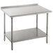 An Advance Tabco stainless steel work table with undershelf and backsplash on a counter.