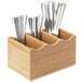 A Cal-Mil bamboo flatware organizer with spoons and forks in it.