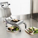 A Nemco Easy Chicken Slicer on a stainless steel counter with pieces of meat on it.