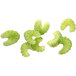 A close-up of celery slices made with a Robot Coupe 28129 slicing disc.