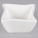 A white square bowl with a curved edge.