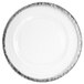 A white Charge It by Jay round charger plate with a silver rim.