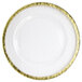 A white round charger plate with a hammered gold rim.