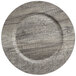 A Charge It by Jay dark gray faux wood melamine charger plate with a circular edge.