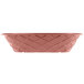 A pink oval weave basket with a patterned design.