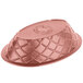 A pink polyethylene oval weave basket with a pattern on it.