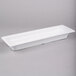 A white rectangular GET melamine food pan with a lid.